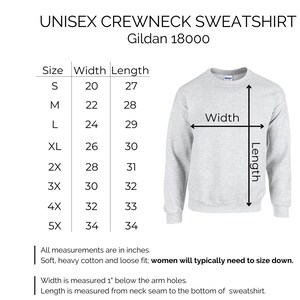 May include: Size chart for a unisex crewneck sweatshirt, showing width and length measurements in inches for sizes S through 5X. The chart is labeled "Unisex Crewneck Sweatshirt" and "Gildan 18000".