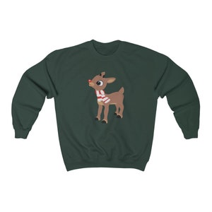 May include: A dark green sweatshirt with a cartoon image of Rudolph the Red-Nosed Reindeer wearing a red and white scarf.