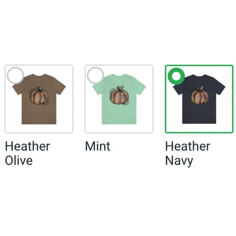 May include: Three t-shirts with a colorful pumpkin graphic. The t-shirts are in heather olive, mint, and heather navy.