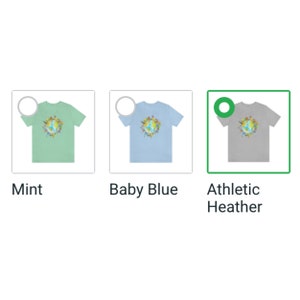 May include: Three t-shirts with a colorful globe graphic. The t-shirts are in mint, baby blue, and athletic heather colors.