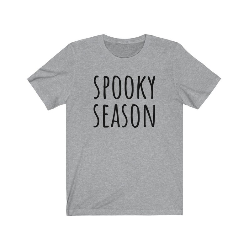 May include: A heather gray t-shirt with the text "SPOOKY SEASON" printed in black.