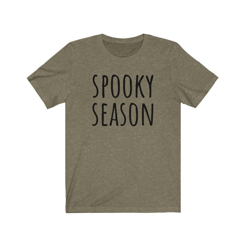 May include: A green t-shirt with the text "Spooky Season" in black.
