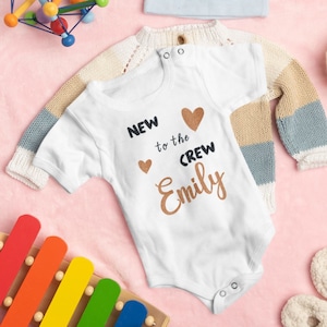 Baby body “New to the Crew” with short and long sleeves in different colours