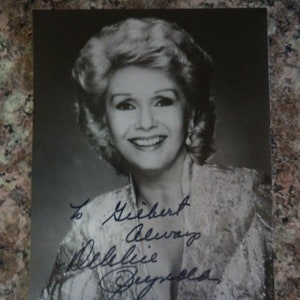 DEBBIE REYNOLDS (1932 – 2016) Autograph, hand signed photo, was in &quot;Singin in the Rain&quot; (1952)