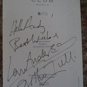 May include: A white card with the text "CLUB WORLD" and a handwritten note that says "Hello Andy. Best wishes.  The United States of America.  Law Anderson.  Ditte Tull.  We apologize if, owing to previous passenger selection, your choice is not available.  BRITISH AIRWAYS"