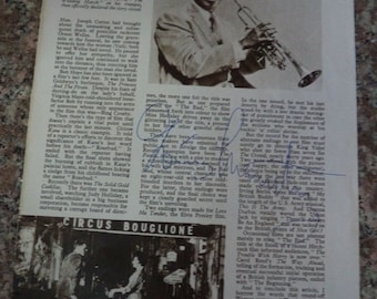 LOUIS ARMSTRONG (1901 – 1971) Autograph, hand signed on magazine cutting 1957