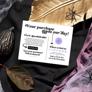May include: A thank you card with a spider web design and the text "Your purchase made our day!" and "You're Spooktacular!" The card also includes a place to add your logo and social media handles.
