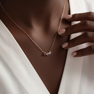 Family birthstone necklace with multiple gemstones, meaningful personalized gift.