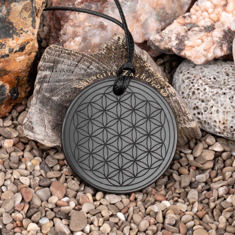 Various Shungite pendants engraved amulets Choose your own Nine different styles Size 1.4 inches Authentic Russian shungite stone Flower of life