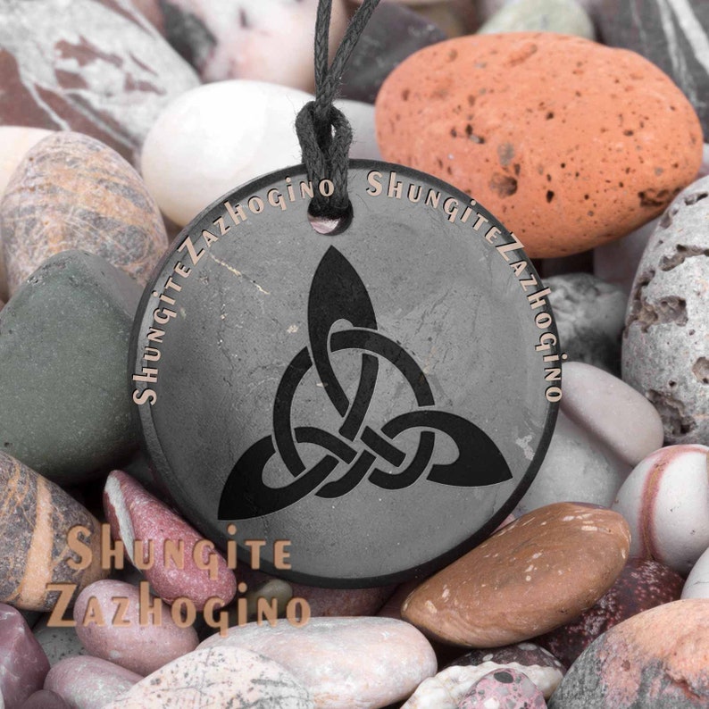 Various Shungite pendants engraved amulets Choose your own Nine different styles Size 1.4 inches Authentic Russian shungite stone Triquetra