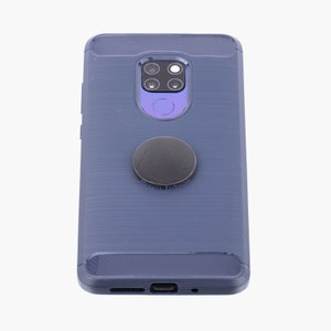 May include: A navy blue phone case with a textured back and a black circular phone grip attached. The case has a camera cutout and a port at the bottom. The phone grip has the text "Shanghai Lazhocks".