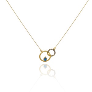 Collana con topazio blu taglio a pera e diamanti, catena in oro giallo 14 carati