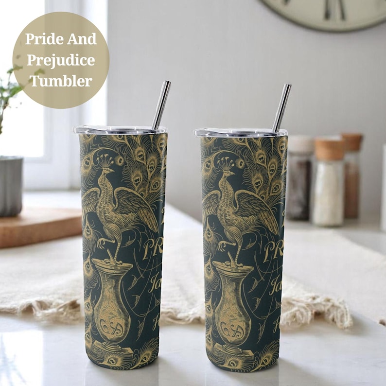 May include: Two stainless steel tumblers with a black and gold design featuring a peacock and the text "Pride and Prejudice".
