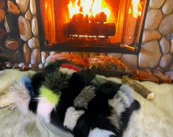 Decorative cushion in recycled fox fur sewn in patchwork style strips