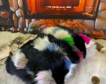 Decorative cushion in recycled fox fur sewn in patchwork style strips