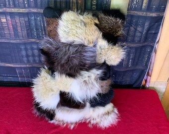 Decorative cushion in recycled fur sewn from multi-fur scraps