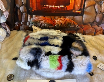 Decorative cushion made from recycled fox fur sewn into patchwork-style strips