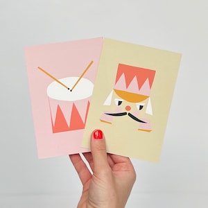 Pappersklippskortset – Fine Art Nötknäppare & Trumkort