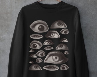 May include: Black sweatshirt with a graphic print of multiple eyes in a vintage style.