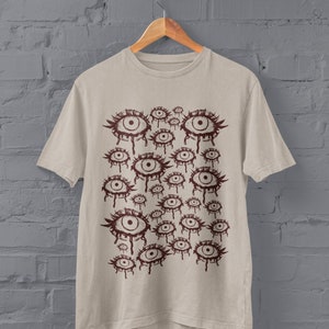 Roupas grunge, roupas alternativas, gótico de shopping, gótico tradicional, roupas Y2K, Fairycore, gótico pastel, camisa gótica, academia escura, camisa estranha, camiseta surreal