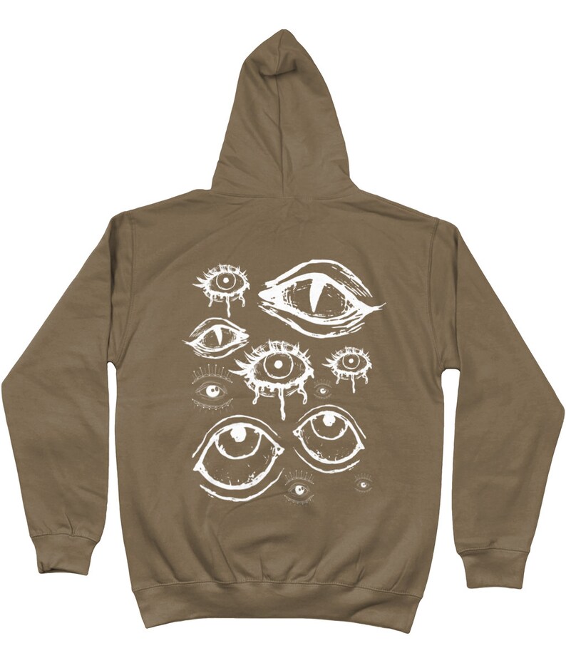 May include: A brown hooded sweatshirt with a white graphic print of multiple eyes on the back.