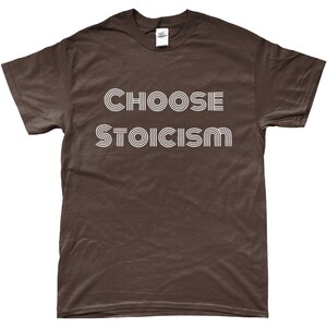May include: A brown t-shirt with white text that reads "CHOOSE STOICISM" in a retro font.