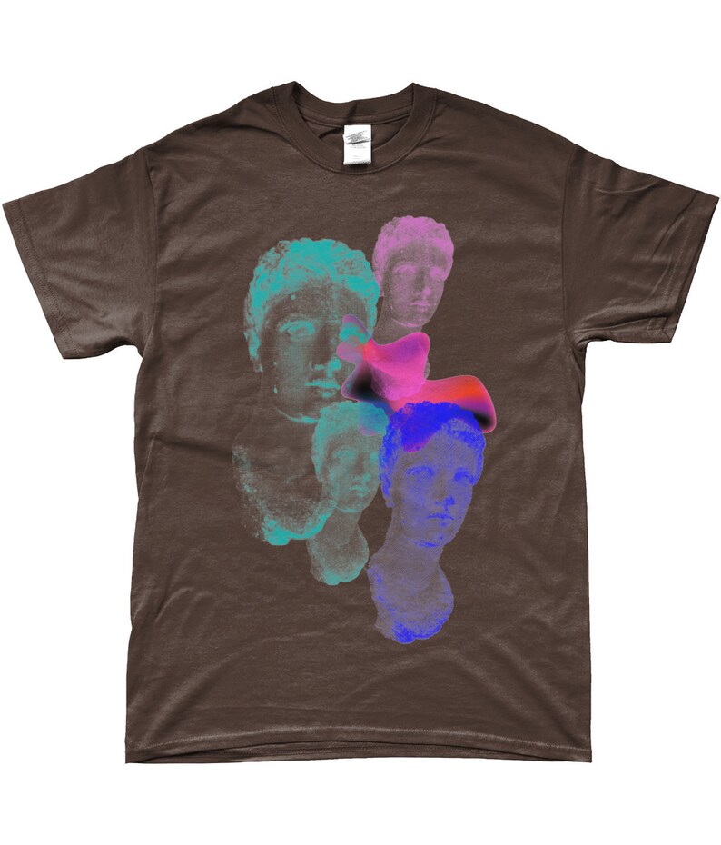 May include: A brown t-shirt with a graphic print of multiple colorful, abstract faces. The faces are layered on top of each other and appear to be made of stone.