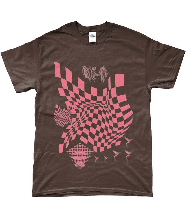 May include: A brown t-shirt featuring a pink checkered pattern, a pink graphic of three figures, and pink hummingbirds.