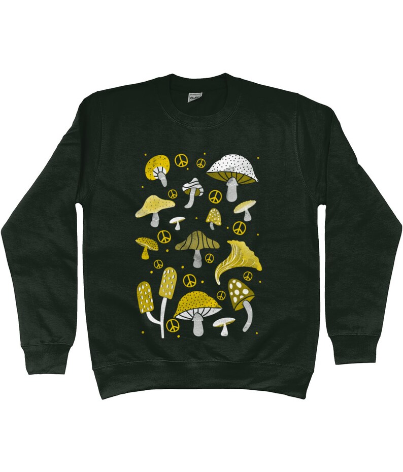 Puede incluir: Una sudadera de color verde oscuro con un dise&ntilde;o de setas blancas y amarillas. Las setas est&aacute;n rodeadas de signos de paz.