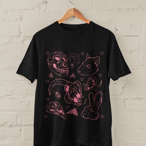 May include: Black t-shirt with a pink graphic print of various animal skulls, insects, and stars.