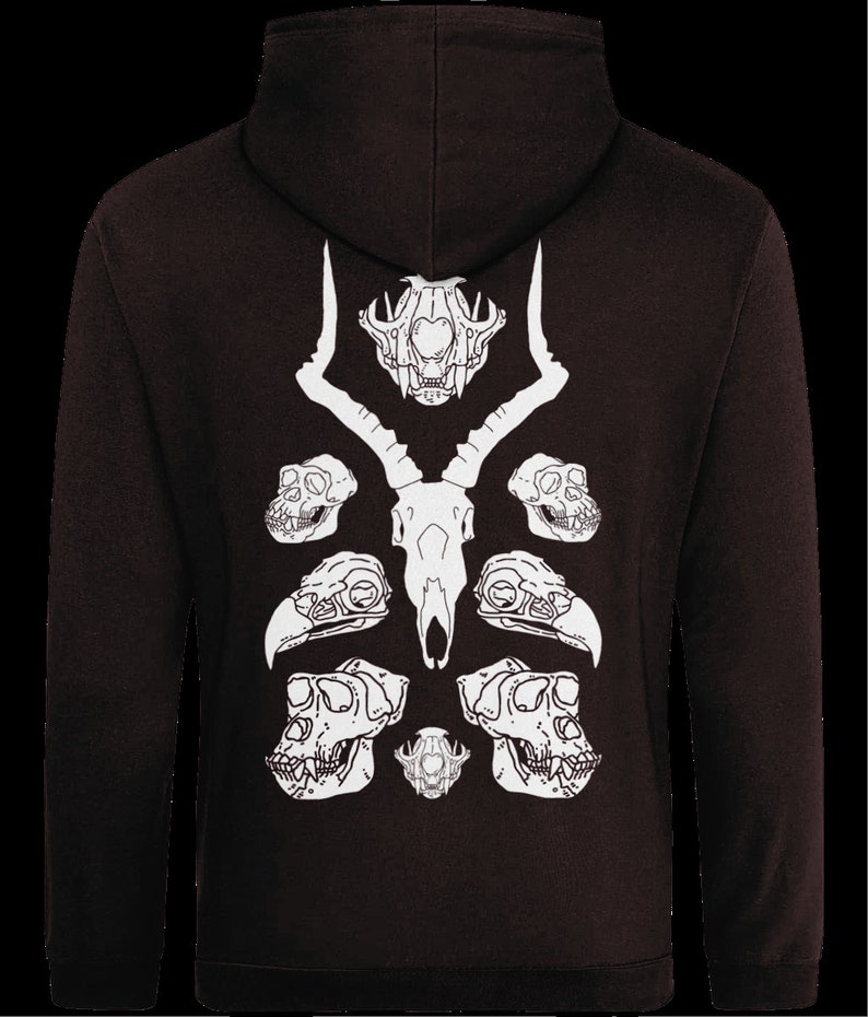May include: A black hoodie with a white design of animal skulls on the back. The design features a deer skull in the center with two bird skulls and two monkey skulls on either side.