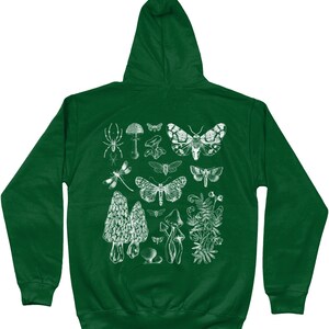 May include: A dark green hooded sweatshirt with a white print of various insects, mushrooms, and plants. The print includes a spider, dragonfly, moths, mushrooms, and a fern.