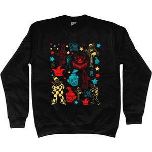 May include: Black sweatshirt with a colorful pattern of clowns, stars, and other circus-themed imagery.