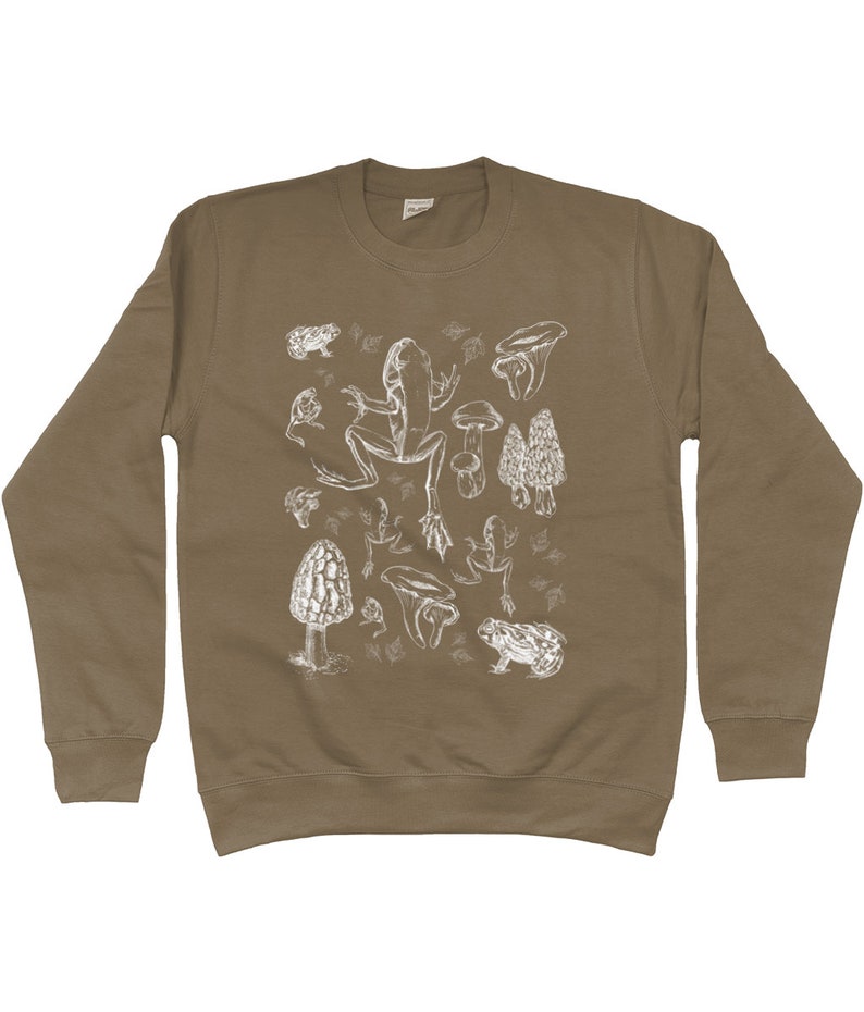 May include: A brown sweatshirt with a white print of various mushrooms, frogs, and toadstools.