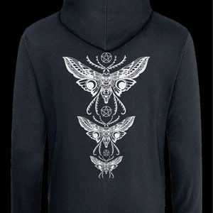 May include: A dark blue hooded sweatshirt with a white graphic print of three stylized moths with pentagram symbols. The moths are arranged vertically with the largest moth at the top and the smallest moth at the bottom.
