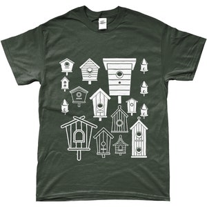 May include: A dark green t-shirt featuring a white design of various birdhouses in different shapes and sizes.