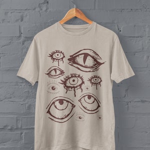 Roupas grunge, roupas alternativas, gótico de shopping, gótico tradicional, gótico pastel, roupas punk, fairycore grunge, camisa grunge, presentes estranhos e únicos
