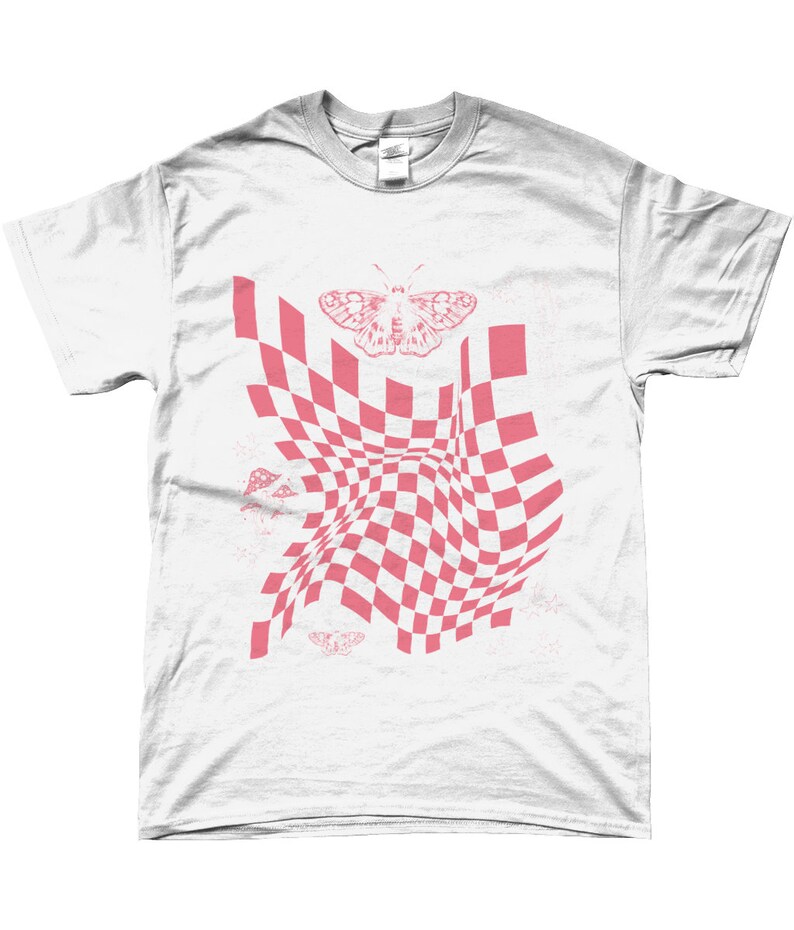 May include: White t-shirt with a pink checkered pattern that appears to be warping or folding. A pink butterfly is centered above the pattern. There are smaller pink butterflies and mushroom shapes scattered around the pattern.