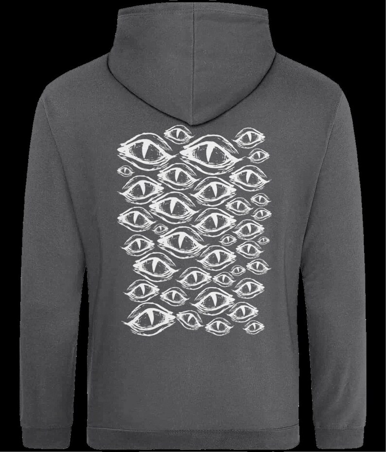 May include: A charcoal gray hooded sweatshirt with a white print of multiple stylized eyes on the back.