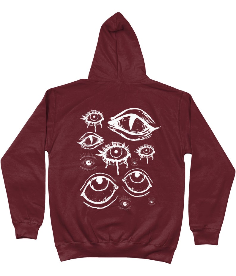 May include: Burgundy hooded sweatshirt with a white graphic print of multiple stylized eyes.