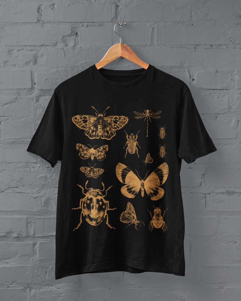 May include: Black t-shirt with a gold print of various insects and butterflies, including a dragonfly, a beetle, and a moth.