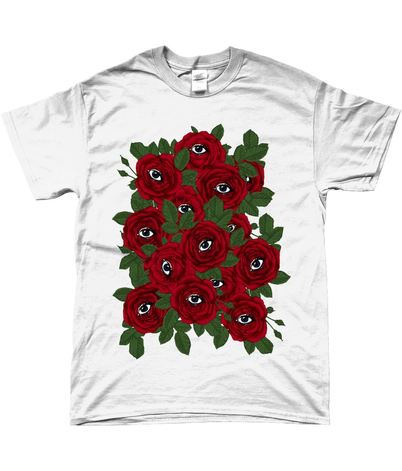 May include: White t-shirt with a graphic design of red roses with eyes in the center of each rose.