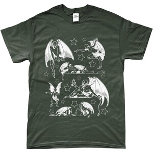 May include: A dark green t-shirt with a white print of multiple winged figures with stars. The figures are in various poses, some are flying, some are sitting, and some are lying down.