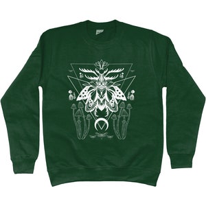 May include: A dark green sweatshirt with a white graphic print of a moth with antlers, mushrooms, and a crescent moon. The moth is surrounded by a geometric design.
