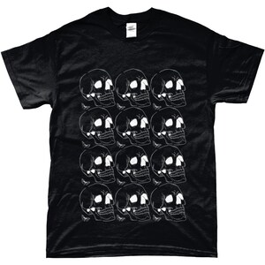 May include: Black t-shirt with a white skull and butterfly pattern. The skulls are arranged in a repeating pattern across the front of the shirt.