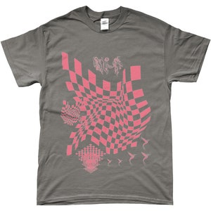 May include: A grey t-shirt with a pink checkered pattern, pink hummingbirds, and a pink abstract design.