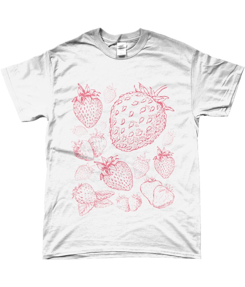 May include: White t-shirt with a pink strawberry print. The strawberries are drawn in a vintage style and are scattered across the shirt.
