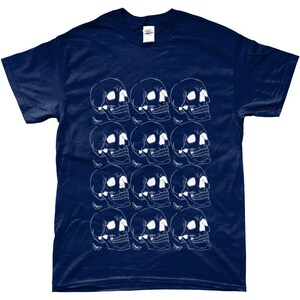 May include: A navy blue t-shirt with a white skull and butterfly pattern. The skulls are arranged in a grid pattern and the butterflies are scattered throughout the design.