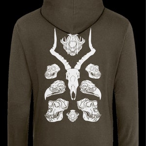 May include: A dark green hooded sweatshirt with a white graphic design of animal skulls. The design features a deer skull with antlers, two monkey skulls, two bird skulls, and a smaller skull in the center.