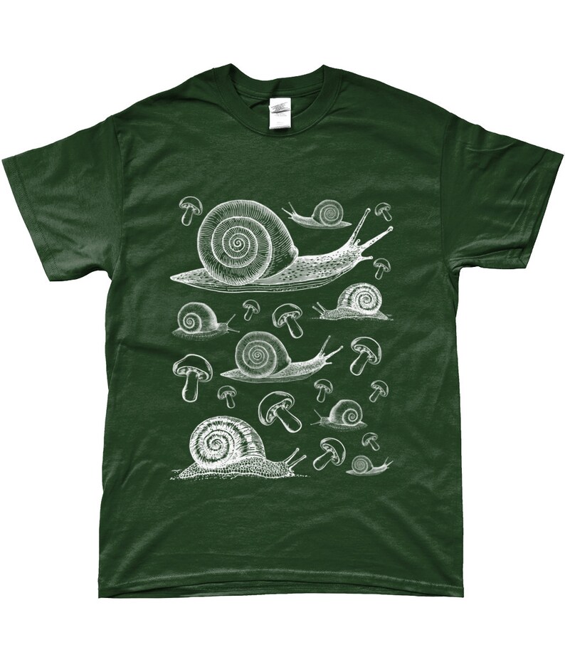 May include: A dark green t-shirt with a white graphic print of snails and mushrooms. The snails are drawn in a vintage style and are surrounded by mushrooms.